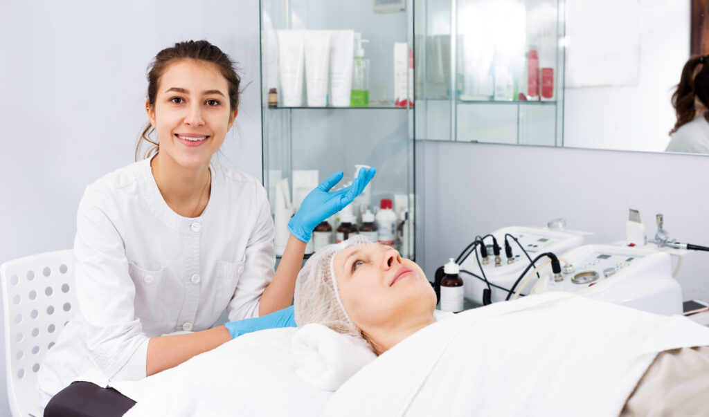 Woman making beauty procedures for face