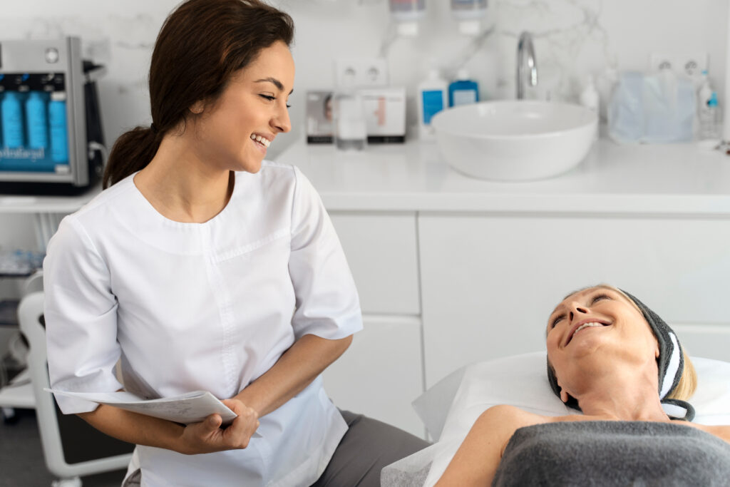 Portrait of charming elderly woman laying on daybed and looking at beautician