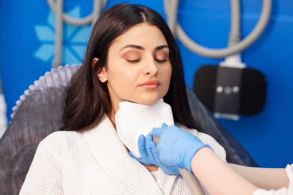 coolsculpting procedure in cosmetology clinic, cosmetologist doctor makes procedure for removing fat from the chin
